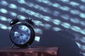 Alarm clock on night table in bedroom Royalty Free Stock Photo