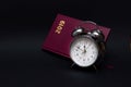 Alarm clock and notebook on black background, 2019 Royalty Free Stock Photo