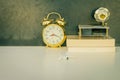 Alarm clock old gold and book, gramophone, plastic plane jet toy passenger. Royalty Free Stock Photo