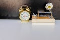 Alarm clock old vintage gold and globe plastic - book, plane ov