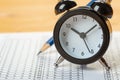 Alarm clock, optical form of standardized school test with bubble and black pencil, answer sheet, education concept