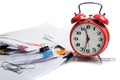 Alarm clock, over pile various documents Deadline business and finance concepts