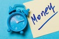 Alarm clock and paper sticker with the inscription. Concept Time - Money Royalty Free Stock Photo