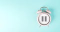 Alarm clock with pause sign, take a break, menopause concept, hormone replacement therapy Royalty Free Stock Photo