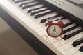 alarm clock on piano, synthesizer Royalty Free Stock Photo