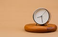 clock placed on a wooden stand, time work concept the value of limited time Appointments and punctuality at work Royalty Free Stock Photo