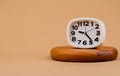 clock placed on a wooden stand, time work concept the value of limited time Appointments and punctuality at work Royalty Free Stock Photo