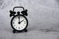 Alarm clock pointing at 2 o'clock with customizable space for ideas or text. Copy space. Royalty Free Stock Photo