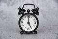 Alarm clock pointing at 5 o'clock with customizable space for ideas or text. Copy space Royalty Free Stock Photo