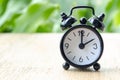 Alarm clock pointing at 2 pm with customizable background space for text or ideas. Time concept. Royalty Free Stock Photo