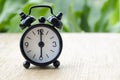 Alarm clock pointing at 6 pm with customizable background space for text or ideas. Time concept. Royalty Free Stock Photo