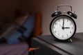 Alarm clock in a retro style shot at home. Royalty Free Stock Photo