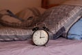 Alarm clock in a retro style shot at home. Royalty Free Stock Photo