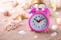 Alarm clock with seashells Royalty Free Stock Photo