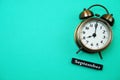 Alarm clock and September calendar with space copy on green mint background Royalty Free Stock Photo