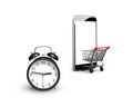 Alarm clock with shopping cart entering smartphone screen Royalty Free Stock Photo