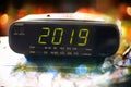 Alarm clock is showing midnight. It is twenty nineteen , christmas and bokeh, holiday happy new year Royalty Free Stock Photo