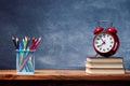 Alarm Clock On Top Of Books On Table Royalty Free Stock Photo