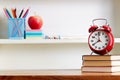 Alarm Clock On Top Of Books On Table Royalty Free Stock Photo