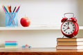 Alarm Clock On Top Of Books On Table Royalty Free Stock Photo