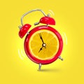 Alarm clock twin Bell-type red with fresh yellow lemon background
