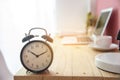 Alarm clock on work tale deadline time business concept. Alarm awake reminder appointment time agenda. selective focus clock on