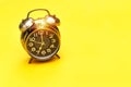 alarm 7 o` Clock on yellow background. Royalty Free Stock Photo