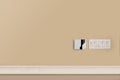Alarm Panel and Light Switches on a Beige Wall Royalty Free Stock Photo