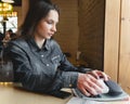 Alarmed girl in a cafe