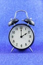 Alarms clock isolated with blue background