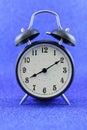 Alarms clock isolated with blue background