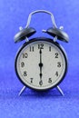 Alarms clock isolated with blue background