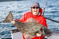 Alaska - Happy Woman Holding Big Halibut Royalty Free Stock Photo