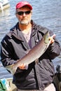 Alaska - Man with Colorful Sockeye Salmon