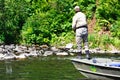 Alaska - Man Fishing for Salmon from Boat