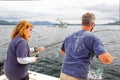 Alaska - Woman Catching Salmon Royalty Free Stock Photo