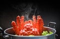 Alaskan King Crab Cooked steamer food on steaming pot seafood and lettuce vegetable with dark background - red crab hokkaido Royalty Free Stock Photo