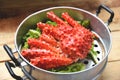 Alaskan King Crab Cooked steamer food on steaming pot seafood and lettuce vegetable on wooden background - red crab hokkaido Royalty Free Stock Photo