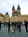 Alaskan malamute with a pink backpack visiting Prague