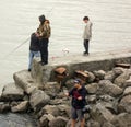 Alaskan residents angling for salmon during subsistence fishing season in the springtime