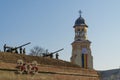 Alba Iulia, Romania - 01.12.2018: Artillery guns and the Reunification Cathedral in the background