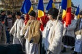 Alba Iulia, Romania - 01.12.2018: Young people carrying Romanian flags at the National Day celebration
