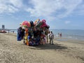 Albania, Durres - 07.07.2023: Characteristic, colorful cart full of swimming inflatable toys and beach accesories. Toys seller Royalty Free Stock Photo