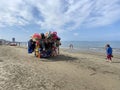 Albania, Durres - 07.07.2023: Characteristic, colorful cart full of swimming inflatable toys and beach accesories. Toys seller Royalty Free Stock Photo