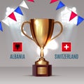 Albania flag and Switzerland flag on soccer ball on soccer background with a gold cup, this design for soccer match of Royalty Free Stock Photo