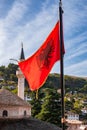Albanian flag and minaret scene in Gjirokaster, Albania