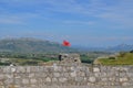 Albanian red flag with a black double-headed eagle at the Fortress of Rozafa. Shkodra, Albania