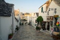 Typical houses built with dry stone walls and conical roofs of the Trulli, in the evening Royalty Free Stock Photo