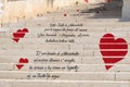 Romantic staircase with love phrases in Italian.