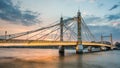 Albert Bridge and beautiful sunset over the Thames, London England UK